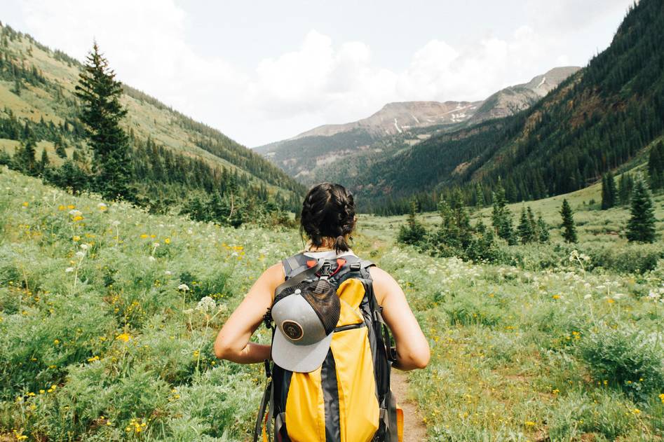 Author hiking in lush forest trail